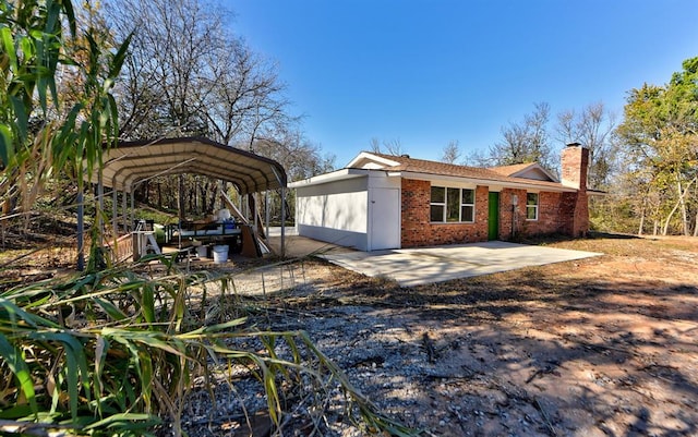 view of property exterior with a carport