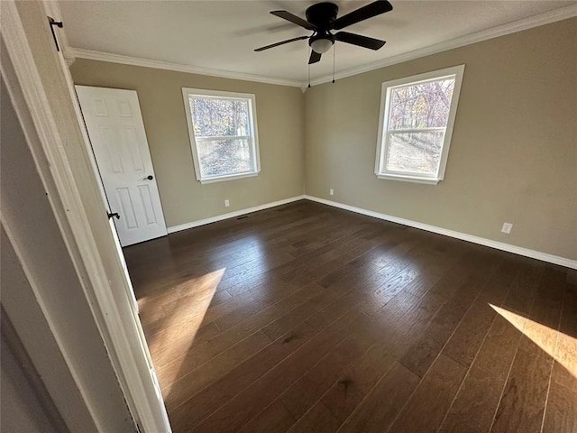 empty room featuring ceiling fan, dark hardwood / wood-style flooring, and crown molding