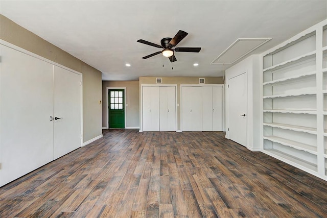 unfurnished bedroom featuring ceiling fan and dark wood-type flooring