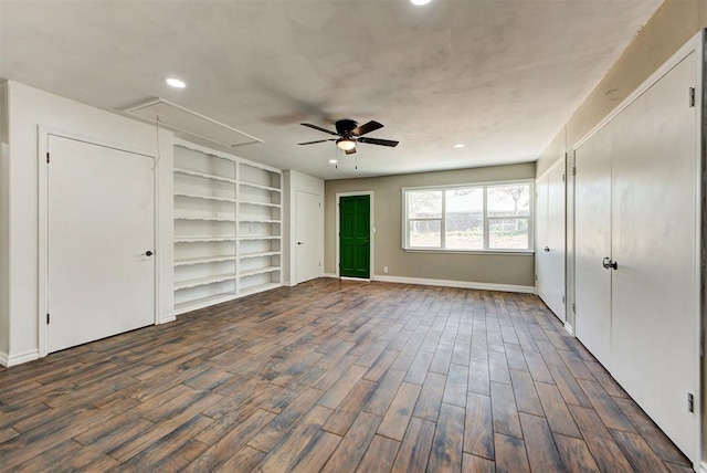 unfurnished bedroom with dark hardwood / wood-style floors and ceiling fan