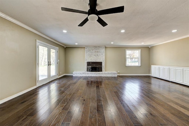 unfurnished living room featuring ceiling fan, a healthy amount of sunlight, ornamental molding, and french doors