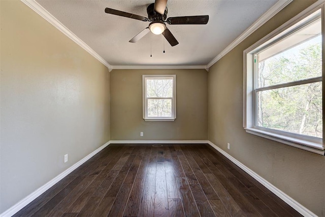 spare room featuring dark hardwood / wood-style flooring, ceiling fan, and crown molding