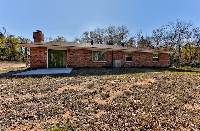 back of house with a patio area and central AC unit