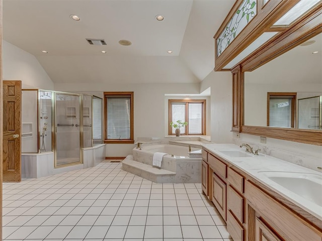 bathroom featuring vanity, tile patterned floors, lofted ceiling with skylight, and plus walk in shower