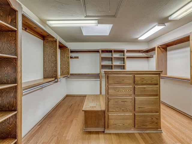 walk in closet featuring light hardwood / wood-style flooring