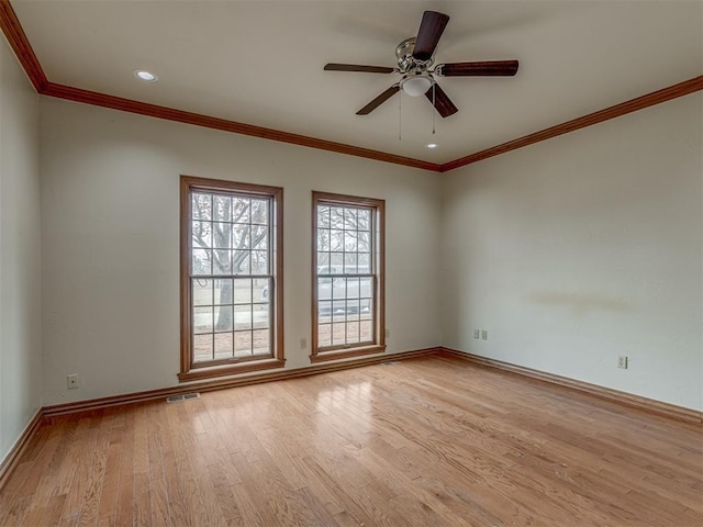 unfurnished room with ornamental molding, ceiling fan, and light hardwood / wood-style flooring