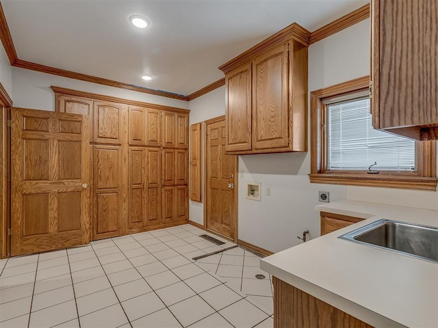 kitchen with ornamental molding and light tile patterned floors