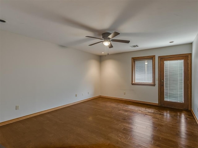 unfurnished room featuring ceiling fan and dark hardwood / wood-style floors