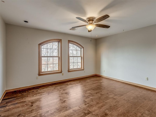 spare room with ceiling fan and hardwood / wood-style floors