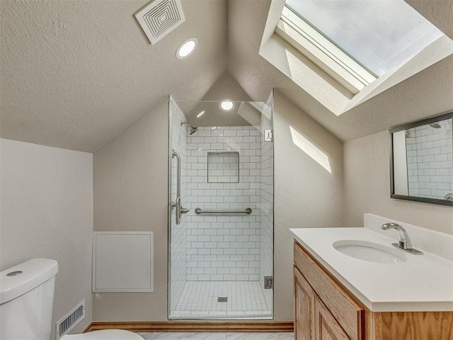 bathroom with lofted ceiling, toilet, a shower with shower door, a textured ceiling, and vanity