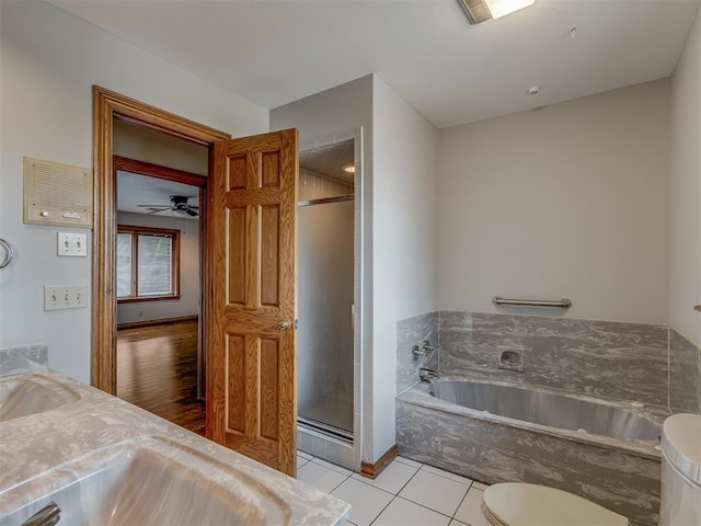 full bathroom featuring vanity, tile patterned floors, toilet, and separate shower and tub