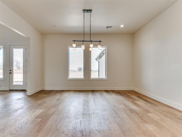 unfurnished dining area with baseboards, recessed lighting, visible vents, and light wood-style floors