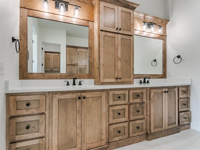 bathroom featuring a sink and double vanity