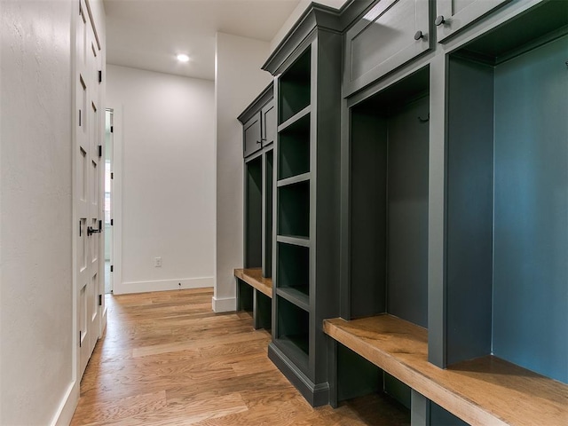 mudroom with baseboards, light wood-type flooring, and recessed lighting