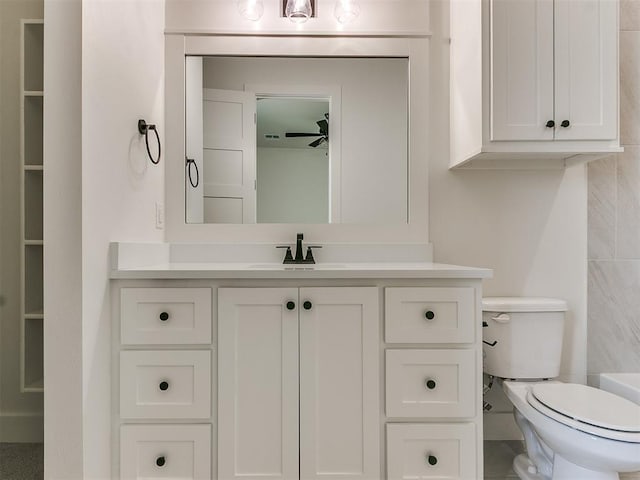 bathroom with vanity and toilet