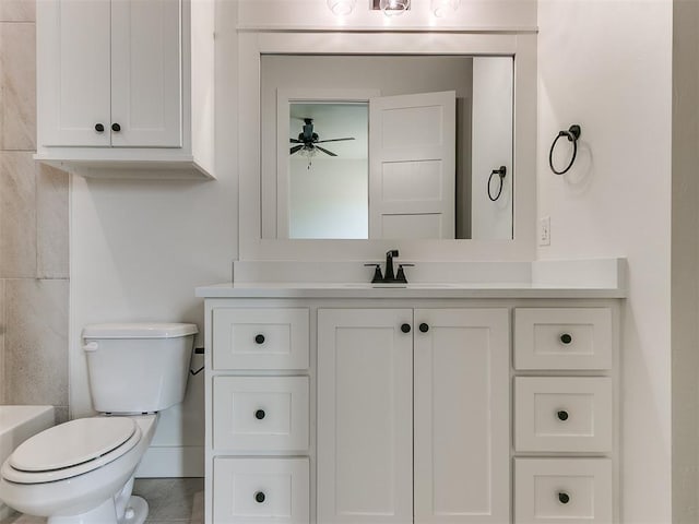 bathroom with toilet and vanity