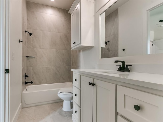 full bath with washtub / shower combination, tile patterned flooring, vanity, and toilet