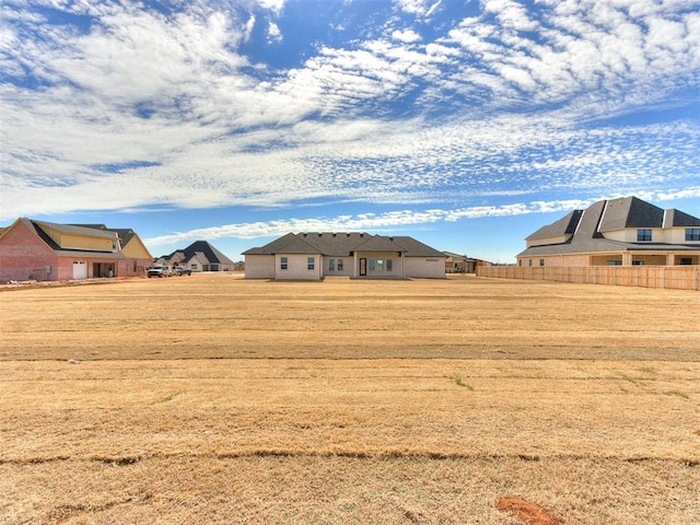 view of yard with fence and a residential view