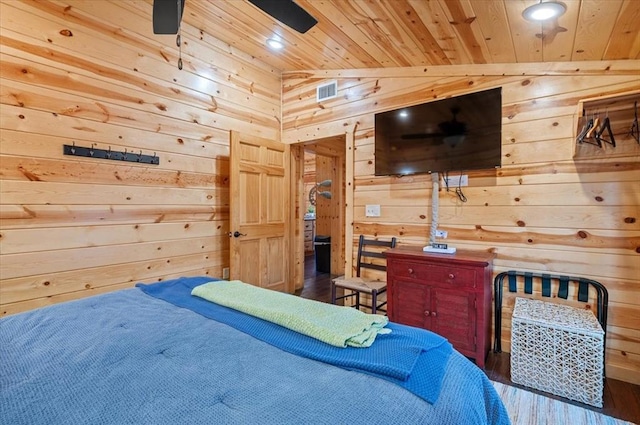 bedroom featuring wood walls, lofted ceiling, dark wood-type flooring, and wooden ceiling