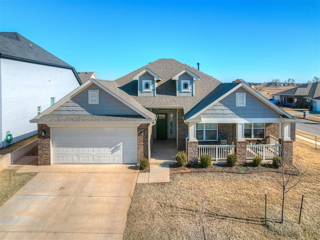 craftsman inspired home with a porch and a garage