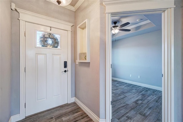 foyer entrance with dark hardwood / wood-style floors and ceiling fan