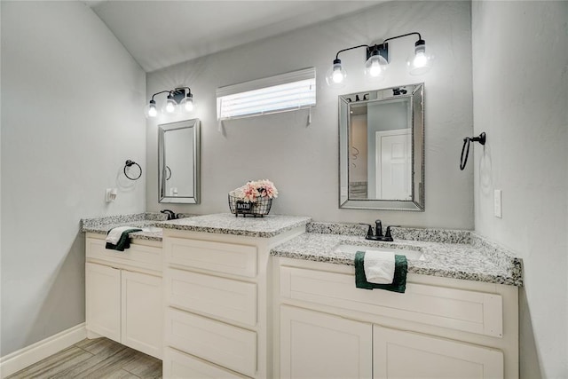 bathroom featuring hardwood / wood-style flooring and vanity