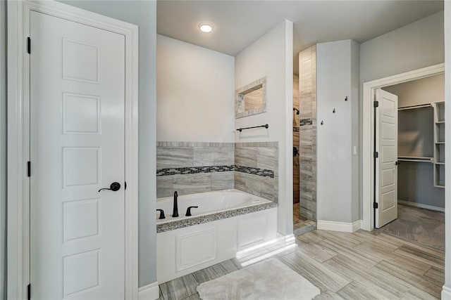 bathroom featuring plus walk in shower