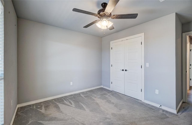 unfurnished bedroom featuring carpet flooring, a closet, and ceiling fan