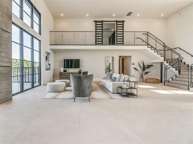 living room featuring a high ceiling