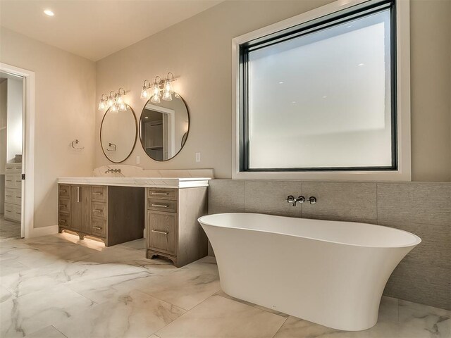 bathroom featuring vanity and a bathing tub