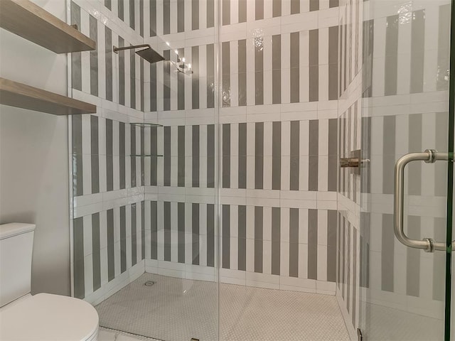 bathroom with toilet and walk in shower