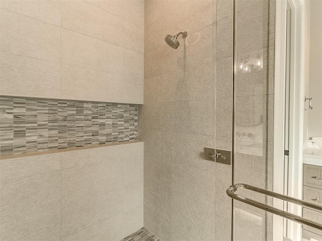 bathroom with tiled shower