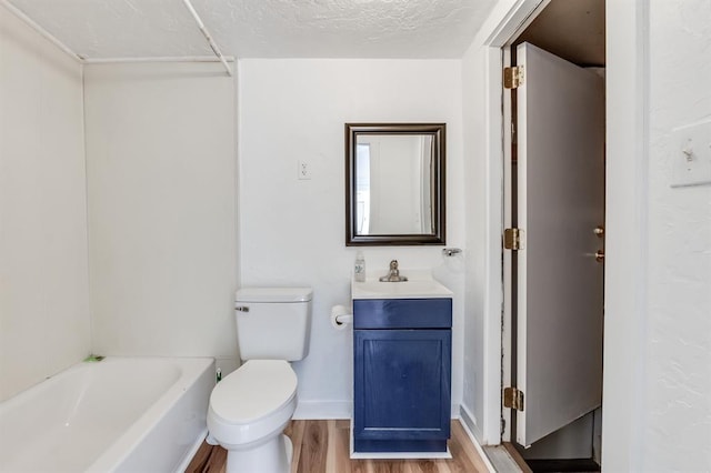 bathroom featuring hardwood / wood-style flooring, vanity, and toilet