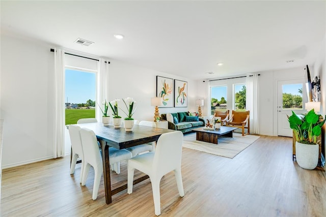 dining space featuring light wood-type flooring