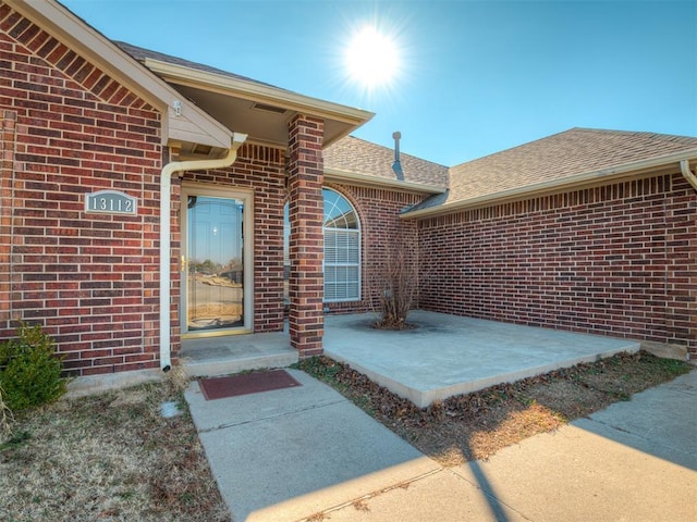 entrance to property featuring a patio