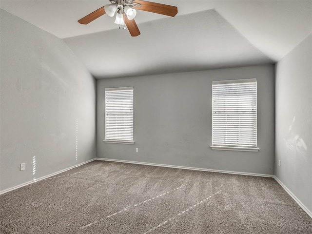 spare room with carpet flooring, ceiling fan, and lofted ceiling