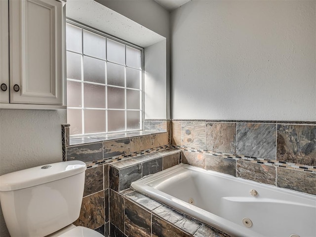 bathroom with a relaxing tiled tub and toilet