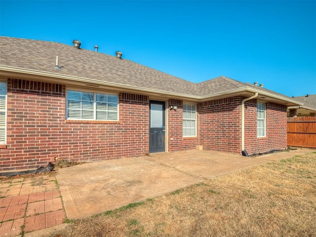 back of property featuring a patio