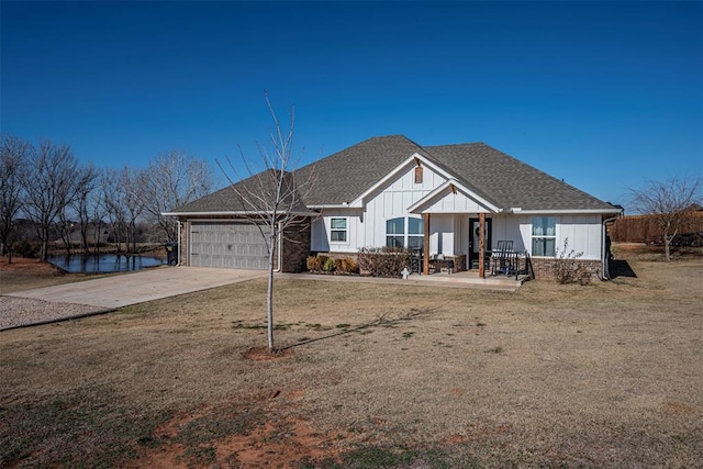 view of front of property featuring a garage and a front yard