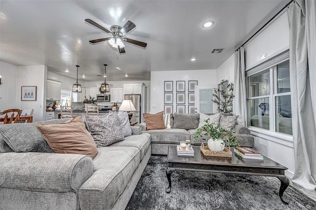 living room featuring ceiling fan