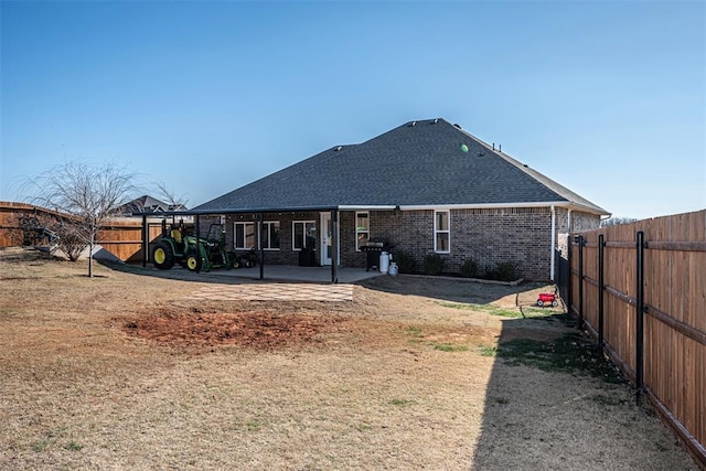 rear view of house featuring a patio