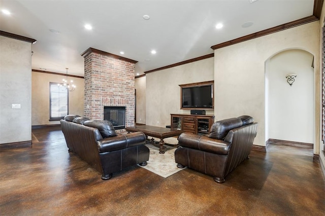 living room with a fireplace, ornamental molding, and a notable chandelier