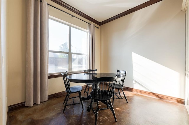 dining room featuring ornamental molding