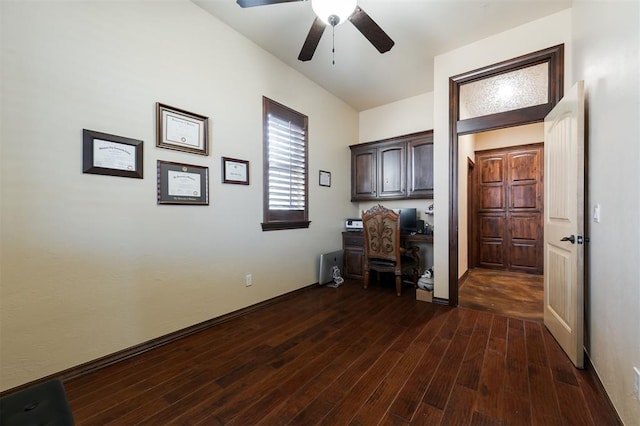 unfurnished office with dark hardwood / wood-style floors and ceiling fan