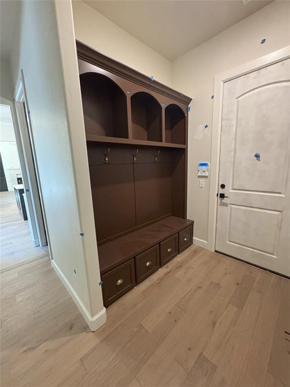 mudroom with light hardwood / wood-style flooring