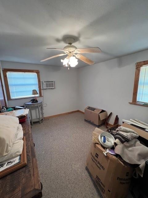 miscellaneous room with ceiling fan, carpet floors, and a wall mounted AC