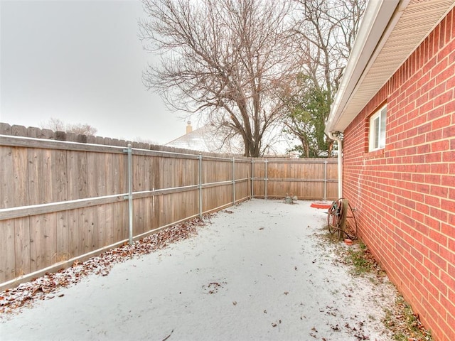 view of yard covered in snow