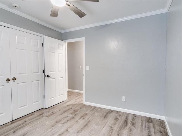 unfurnished bedroom featuring a closet, ceiling fan, ornamental molding, and light hardwood / wood-style floors