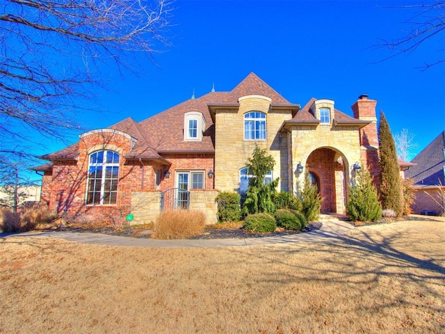 french country home with a front yard