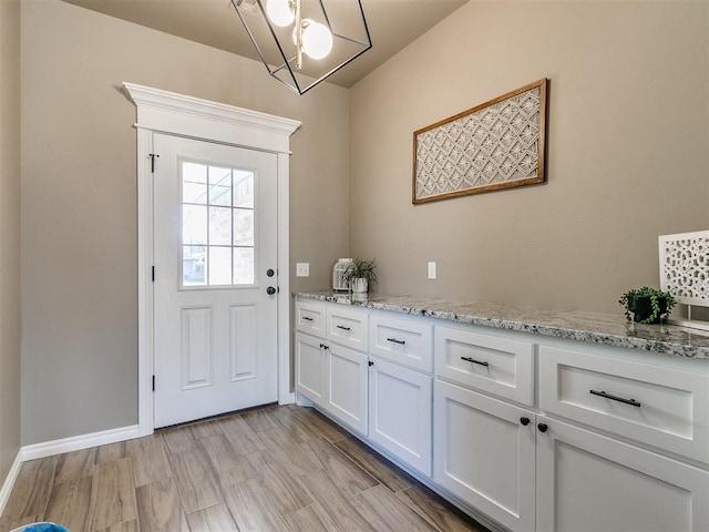 entryway with light hardwood / wood-style floors